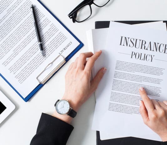 Business woman showing insurance document