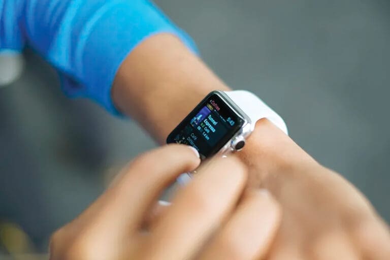 Person Checks Stats On The Screen Of Their Apple Watch. Original
