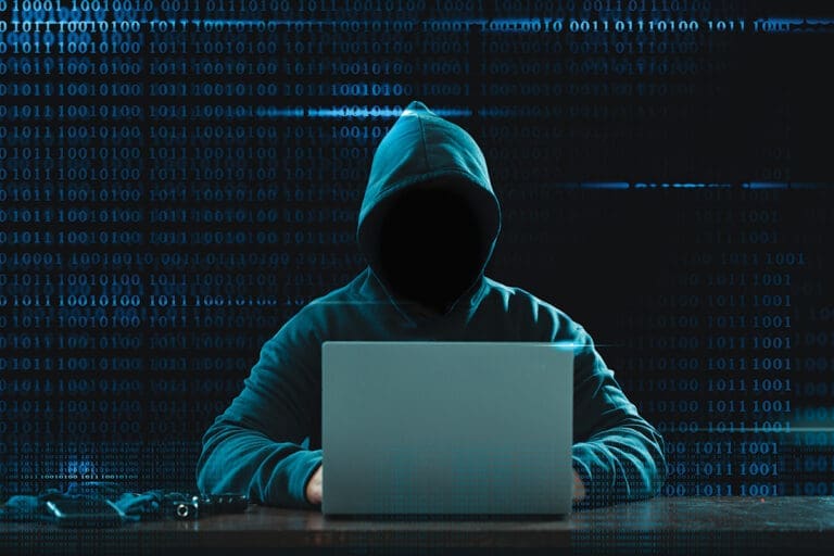 Big Financial Data Theft Concept. An Anonymous Hacker Is Hacking Highly Protected Financial Data Through Computers.