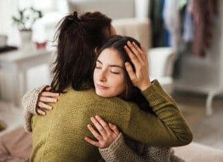 Teenager Hugging Parent Istock 1476266423